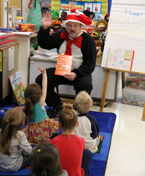 Sandy Creek Elementary School Principal Tim Filiatrault dressed as the Cat in the Hat and read a Dr. Seuss book, “Green Eggs  and Ham” to the student classes who won the top reading spot for the month. 