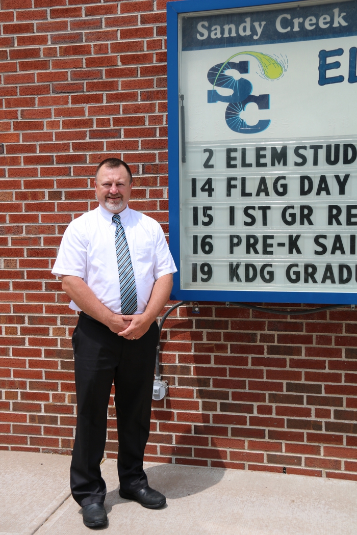 Sandy Creek Elementary School Principal Tim Filiatrault outside of the school on one of the last days of the school year will take the helm of the school on July 1.
