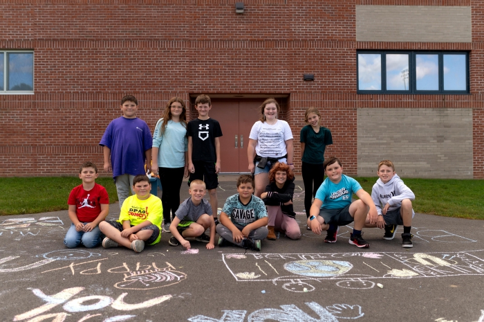 Sara McNitt’s sixth-grade class shows off their creative, positive, and inspiring chalk art.  