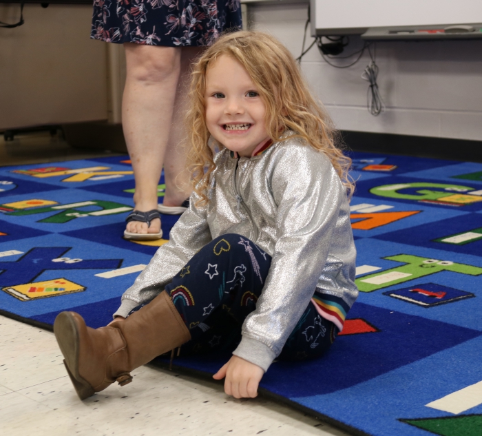 Incoming pre-K student Adrianna Skellen picked out a spot on the classroom rug. 
