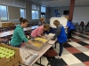 Sandy Creek CSD staff members work to prepare meals for district students before they are distributed across the district.