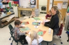 Students in the pre-K class make cards for the troops.