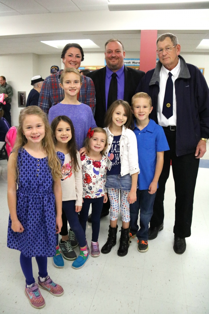Pictured with their special Veteran guest at Sandy Creek Elementary School are several families from the Sandy Creek area. In front, left to right: Adelle Harris, Lily Wall, Helen Harris, Leia Wall, and Grant Harris. Middle row: Sophie Harris and Larry Ecker; in back: Andrea Harris and Kyle Faulkner. Ecker is Mr. Faulkner and Mrs. Harris’ uncle and is a veteran having served in the US Navy.