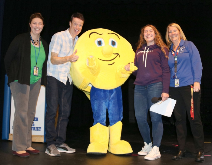 “I can honestly say,” said Andy Thibodeau, “that I have never been introduced by a Comet before!” Pictured left to right are: Sandy Creek High School Principal Emily Wemmer, Thibodeau, SC Comet mascot (Bailey Fahnestock), Alison Lantry and Middle School Principal Carolyn Shirley.
