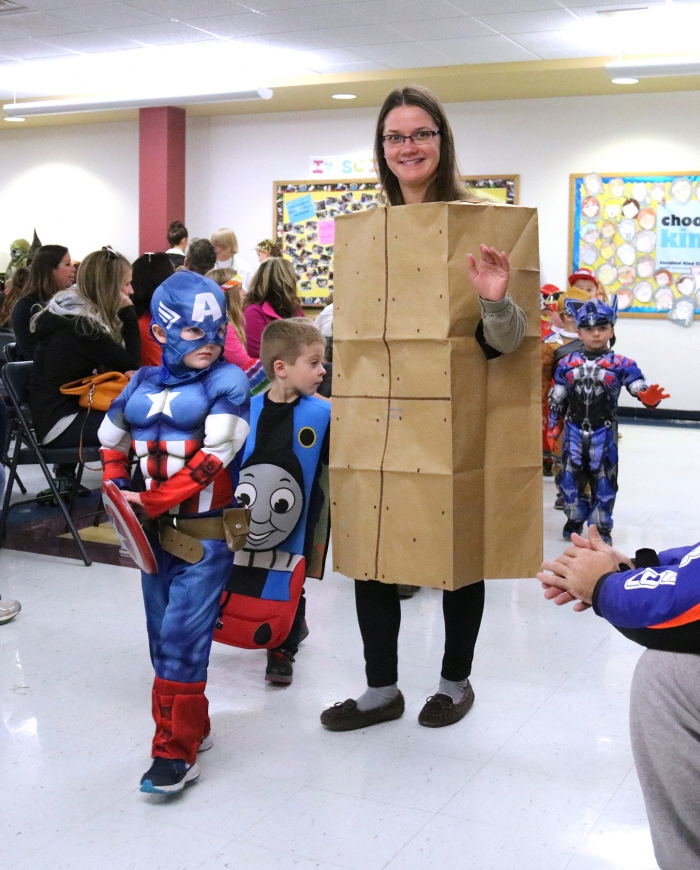 The Pre-Kindergarten class led the annual Halloween Parade with Mrs. McNitt and Captain America!