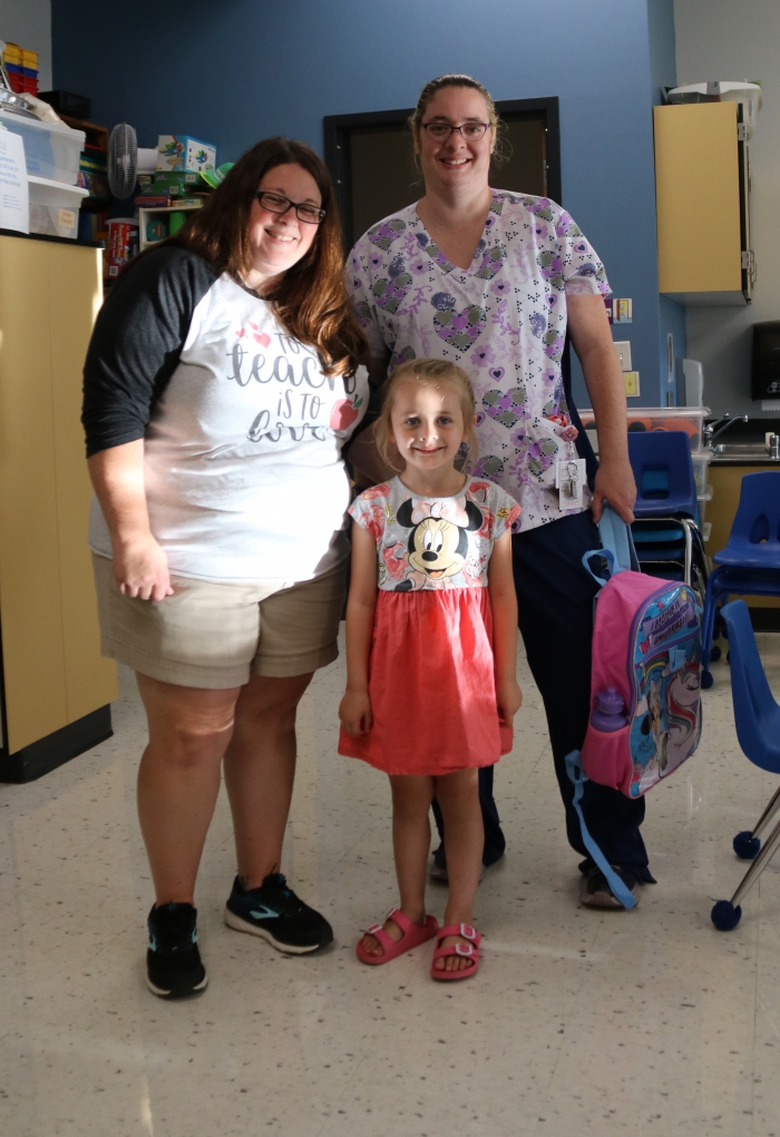 Chloe Shrock and her mom, Audrey Shrock, meets kindergarten teacher Mrs. Norton during the sundaes and smiles event.  