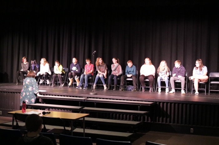 The whole field of participants in this year's Sandy Creek spelling bee is pictured taking final instructions from Brandie Norton, a SCCSD teacher who ran the event.