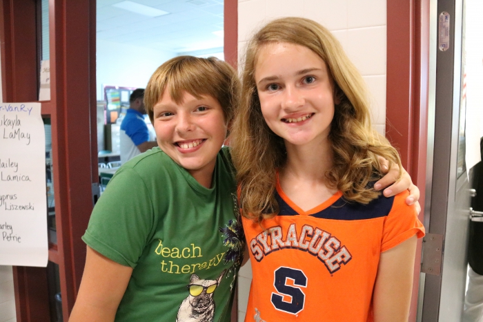 Elizabeth Hobbs and Sophie Harris were excited to see each other at the 6th grade orientation.