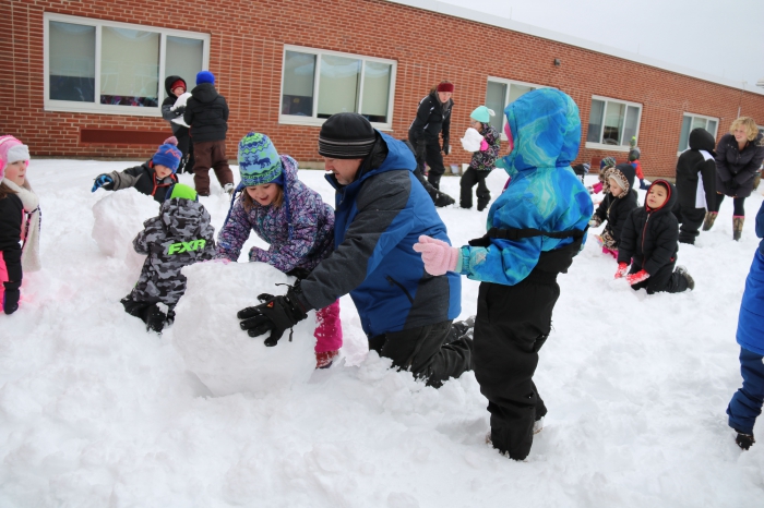 Teams of first grade students created snowmen as part of their reward for reading the most books at home during the January reading challenge at Sandy Creek Elementary School. Principal Tim Filiatrault joined the teams in their snowmen building.