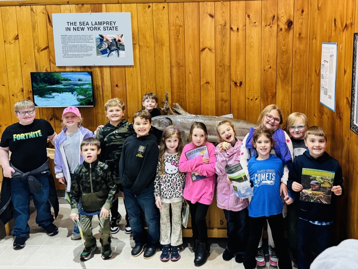 Students pose for a group photo at the Fish Hatchery.