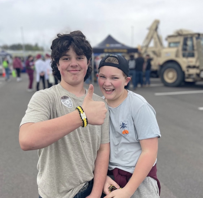 Students smile at the Public Safety and Armed Forces Expo