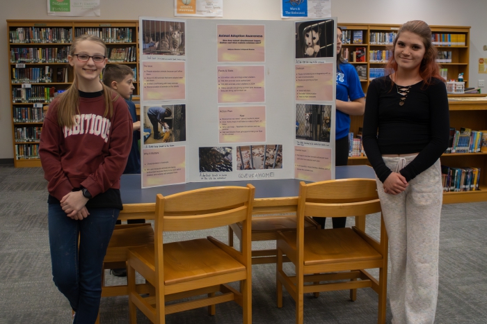 Lilyanah D. left, Addyson K. right Photo Caption: Left Lilyanah D., right Addyson K. with their presentation.