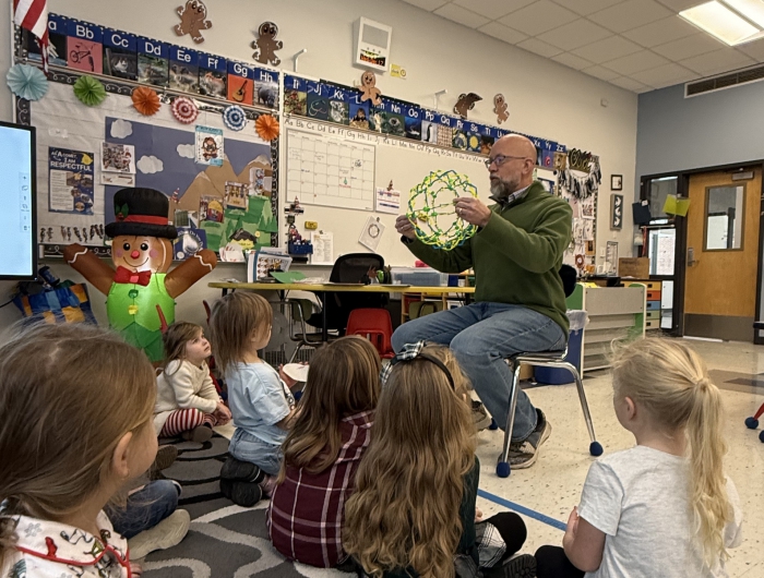  Sandy Creek graduate donates books and leads wellness activities for students