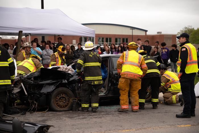 SCCS juniors and seniors watch local first responders in action during a Mock DWI crash outside of their school. 