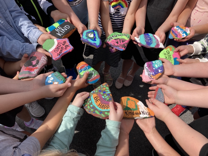 Students show off their Kindness Rocks.
