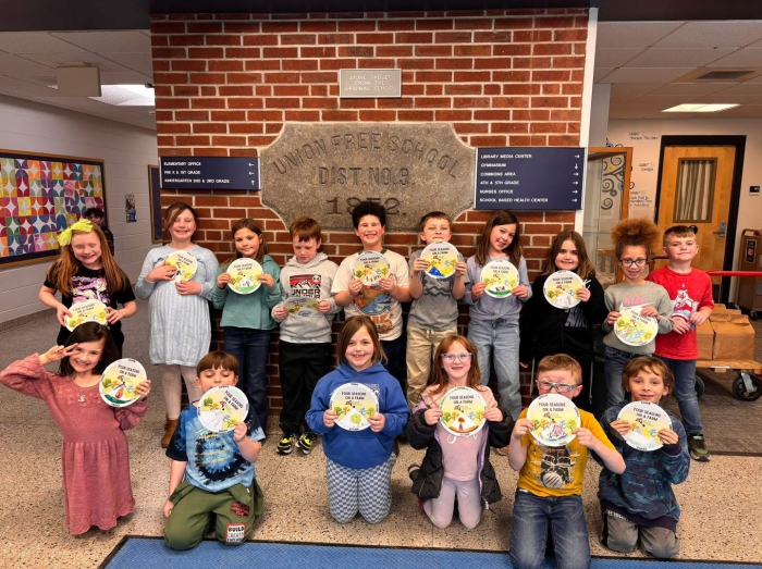 Students pose with their agriculture day project.
